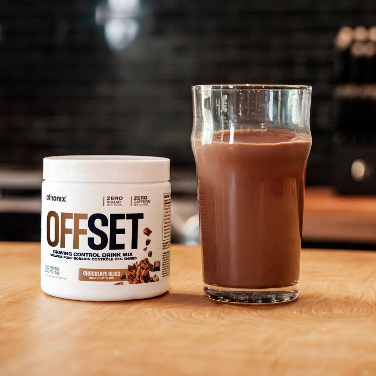 Athonix OFFSET Chocolate Bliss bottle beside a freshly mixed drink